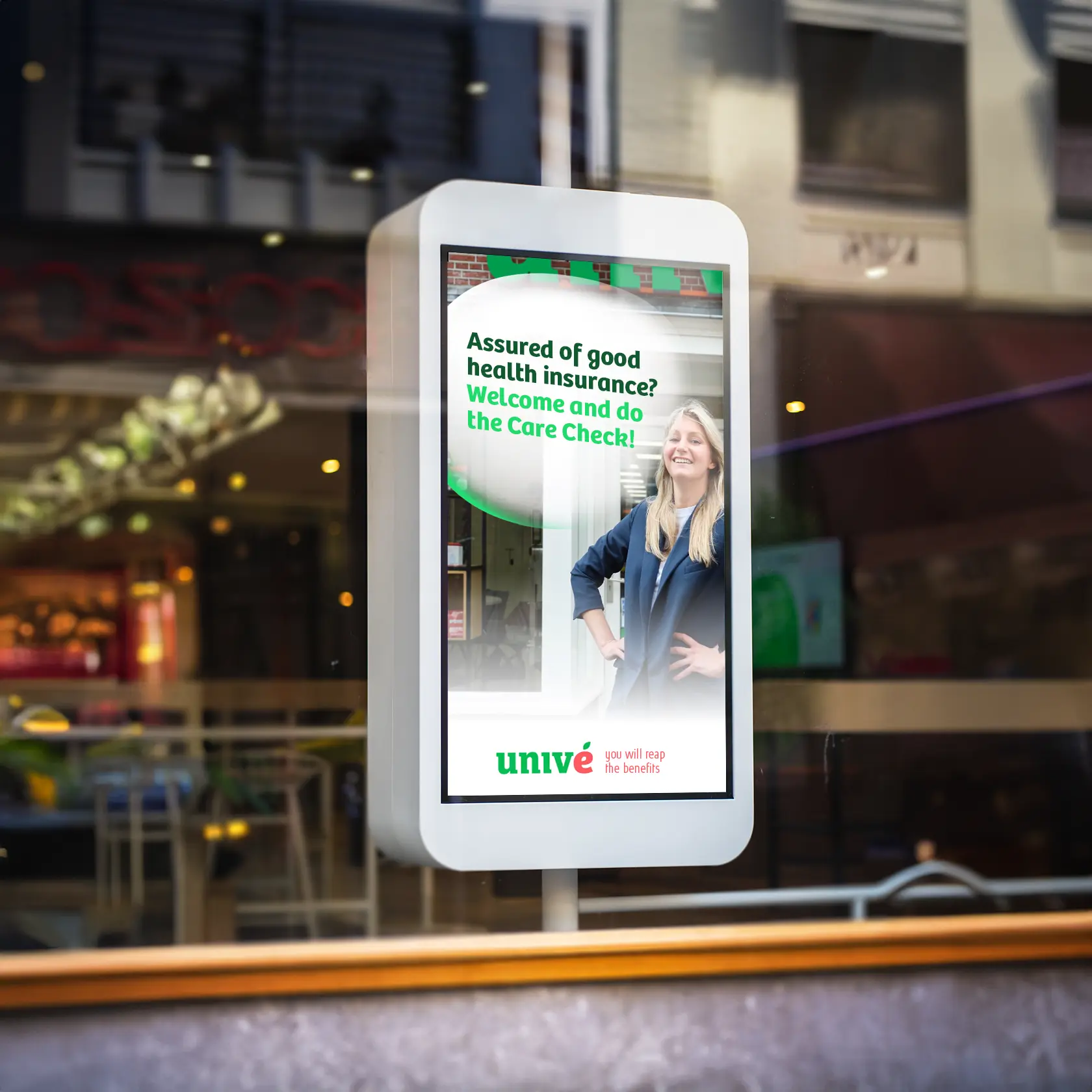 Digital shopwindow screen displaying health insurance content.